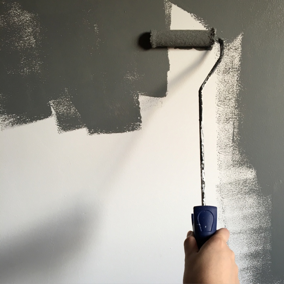 Professionals painting over drywall
