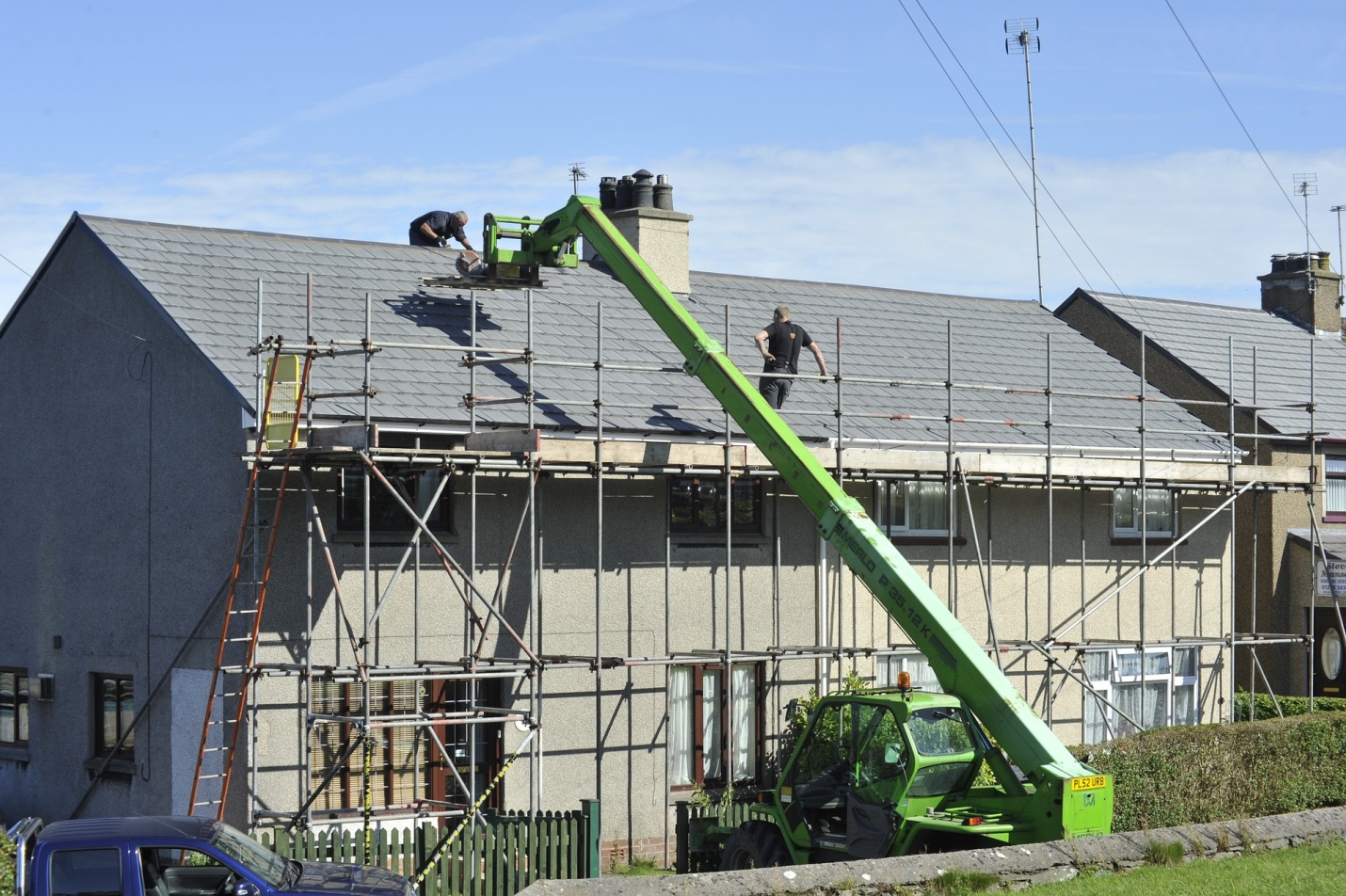 A roof of a house being repaired