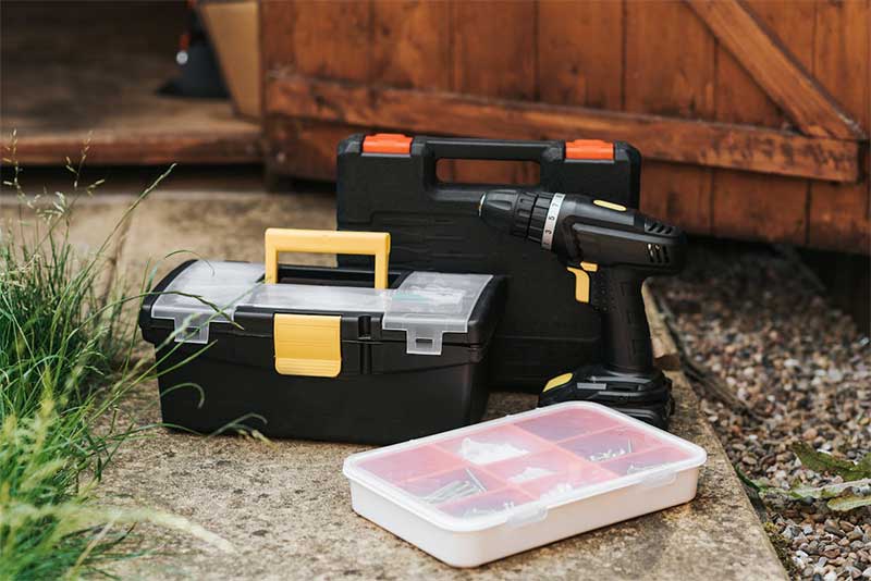 A photo of repair tools on the concrete floor. 